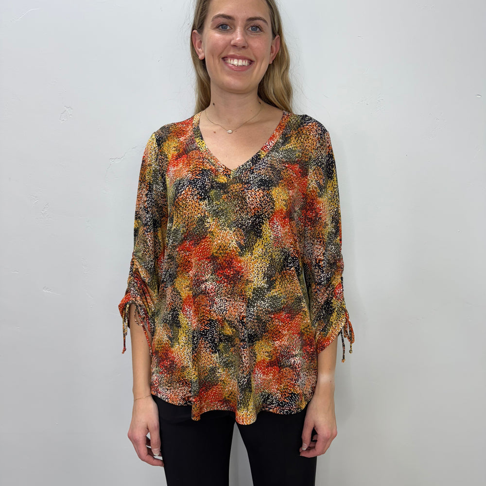 
                  
                    Orange Pattern V-Neck Tunic with Ties
                  
                