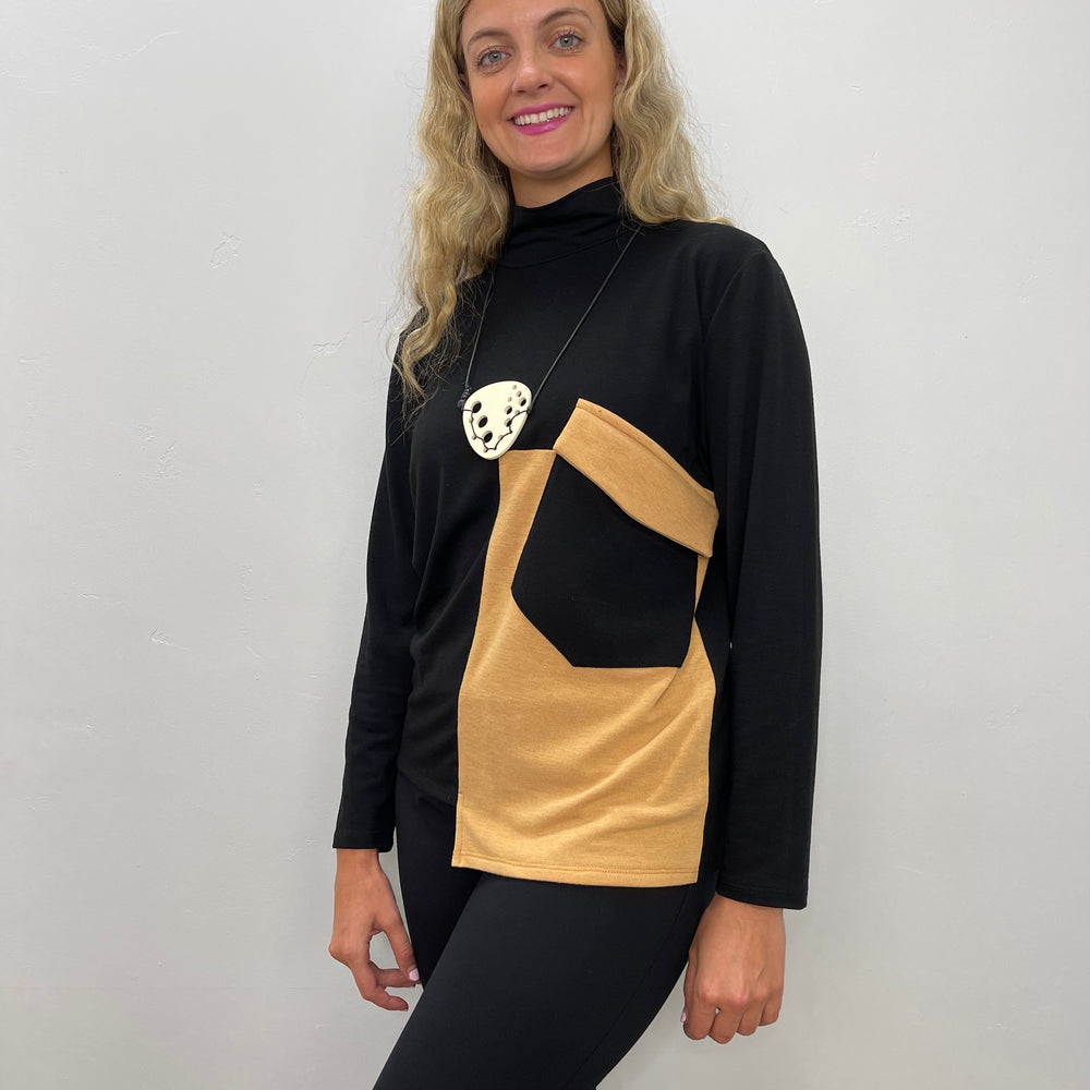 
                  
                    Black and Tan Turtle Neck Top
                  
                